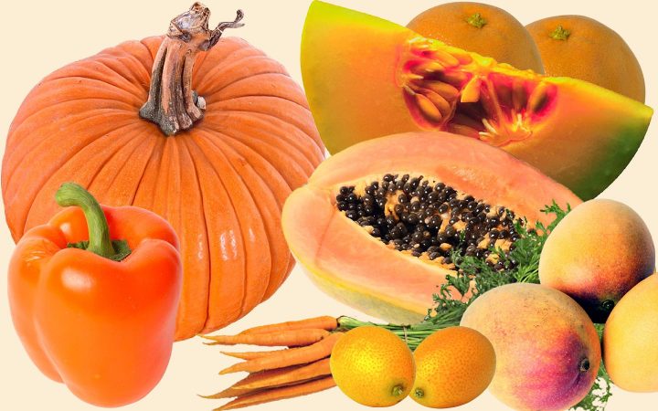 Surtido de frutas y verduras de color naranja, incluyendo calabaza, melón, naranja, zanahorias, mangos y pimientos.