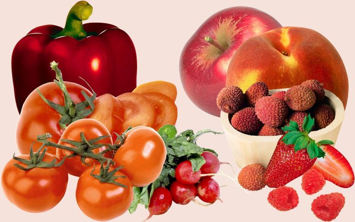 Surtido de frutas y verduras rojas, incluyendo tomates, rábanos, fresas, lichis, manzanas, peras y pimientos.